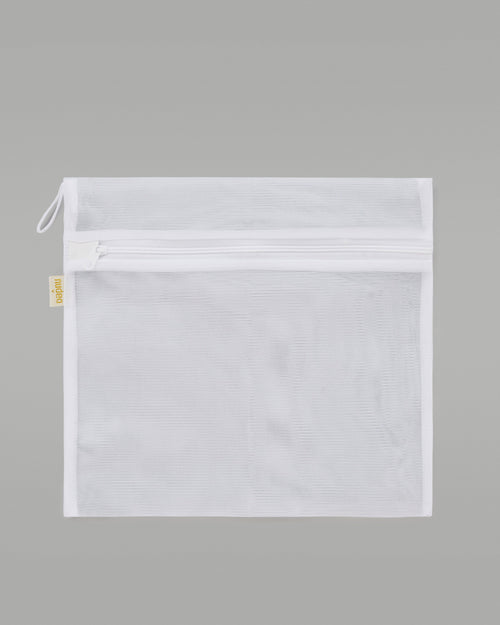 A NUDEA laundry bag in white, used for washing lingerie